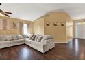 Large living room with hardwood floors, neutral walls, and a comfy sectional sofa at 1771 Turtle Rock Dr, Lakeland, FL 33803