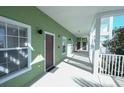 Building hallway with green walls and brown doors at 606 Gran Bahama Boulevard # 29-606, Davenport, FL 33897