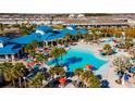 Resort-style pool with a clubhouse and surrounding palm trees at 1166 Aloha Blvd, Davenport, FL 33897
