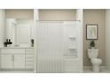 Bathroom featuring a shower/tub combo and white vanity at 780 Osprey Roost Dr, Lakeland, FL 33801