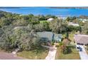 Bird's-eye view of a house near a lake, showcasing its location and surroundings at 151 Pine St, Babson Park, FL 33827