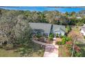 Aerial view of a waterfront home with a spacious yard at 151 Pine St, Babson Park, FL 33827