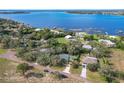 Community overview showing lakefront properties and lush greenery at 151 Pine St, Babson Park, FL 33827