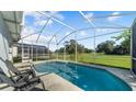 Relaxing screened pool area overlooking a golf course at 745 Jaybee Ave, Davenport, FL 33897