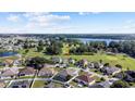 Aerial view of house and surrounding golf course community at 745 Jaybee Ave, Davenport, FL 33897