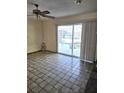 Living room with pool view and tile floors at 748 Merrimac Dr, Port Orange, FL 32127