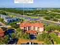 Aerial view of condo building and surrounding landscape at 5560 Metrowest Blvd # 304, Orlando, FL 32811