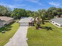 House with a two-car garage and large yard at 2739 Everleth Dr, Lakeland, FL 33810