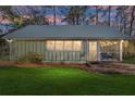 Charming cottage with metal roof, screened porch, and brick steps at 10801 Sw 185Th Ter, Dunnellon, FL 34432