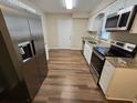 Modern kitchen with granite countertops and stainless steel appliances at 1911 High St, Leesburg, FL 34748