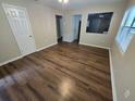 Living room with dark wood laminate flooring at 1911 High St, Leesburg, FL 34748