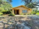 Brick ranch home with front porch and landscaping at 250 W New York Ave, Orange City, FL 32763