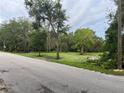 Vacant lot with mature trees and grassy area, ready for new construction at 150 Ridge Blvd, Deland, FL 32724