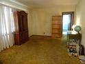 Living room featuring hardwood floors and built-in shelving at 217 Catalonia Ave, De Leon Springs, FL 32130