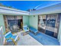 Private balcony with patio furniture at 4150 S Atlantic Ave # 107C, New Smyrna Beach, FL 32169
