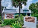 Bahamian Club entrance with signage and landscaping at 4150 S Atlantic Ave # 107C, New Smyrna Beach, FL 32169