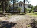 Two story home with mature landscaping and large yard at 207 E 2Nd Ave, Pierson, FL 32180