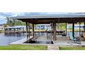 Private dock with a boat lift and seating area, perfect for relaxing at 1628 Paradise Ln, Astor, FL 32102