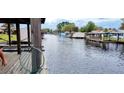 Scenic view of a canal with waterfront homes and lush greenery at 1628 Paradise Ln, Astor, FL 32102