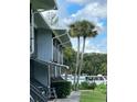 Gray building exterior with walkway and landscaping at 2329 River Ridge Rd # 160, Deland, FL 32720