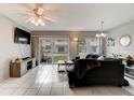 Living room with tiled floors and sliding doors at 2801 N Halifax Ave # 143, Daytona Beach, FL 32118