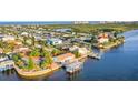 Waterfront property aerial view, showcasing a large home and private dock at 138 Old Carriage Rd, Ponce Inlet, FL 32127