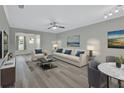Bright living room with comfy seating and a large window at 217 N Hill Ave # 20, Deland, FL 32724
