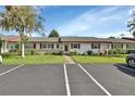 Quaint ranch home with red accents and a stone facade at 217 N Hill Ave # 20, Deland, FL 32724