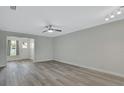 Spacious living room featuring hardwood floors and neutral walls at 217 N Hill Ave # 20, Deland, FL 32724