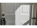 White front door with keyless entry at 2700 Ocean Shore Blvd # 111, Ormond Beach, FL 32176