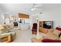 Bright living room with comfy seating and open kitchen view at 1601 Big Tree Rd # 1204, South Daytona, FL 32119