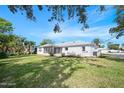 Screened patio and spacious backyard with landscaping at 36 Dresden Cir, Ormond Beach, FL 32174