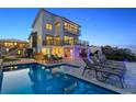 Luxury pool with lounge chairs and stunning ocean view at 4111 S Atlantic Ave, Port Orange, FL 32127