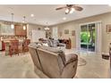 Open living room with sectional sofa and access to backyard at 605 Champions Gate, Deland, FL 32724