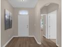 Bright entryway with hardwood floors, and neutral-toned walls at 1223 Ardwell Ct, Deland, FL 32724