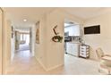 Bright condo hallway with view into living area and kitchen at 4 Oceans West Blvd # 208C, Daytona Beach Shores, FL 32118