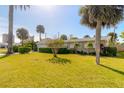Tan one-story house with attached garage at 100 Talo Cir, Port Orange, FL 32127