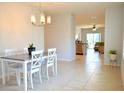 Bright dining room with a table and chairs, view to living room at 226 Meghan Cir, Deland, FL 32724