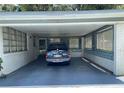 Covered carport attached to white brick house at 2202 Lake Ruby Rd, Deland, FL 32724