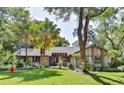 Beautiful house exterior showcasing a well-maintained lawn and lush landscaping at 121 Willow Bend Ln, Ormond Beach, FL 32174