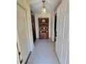 Entryway with tiled floor and built-in shelving at 833 E 22Nd Ave, New Smyrna Beach, FL 32169