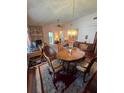 Bright dining room featuring hardwood floors and a charming wooden table at 833 E 22Nd Ave, New Smyrna Beach, FL 32169