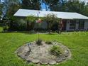 Charming single story home, landscaped front yard at 24008 Ermine Rd, Astor, FL 32102