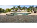 Freeform pool with paver deck and lounge chairs at 2273 Grayling St, Orlando, FL 32820