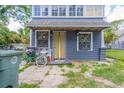 Gray house exterior with yellow door at 432 Marion St, Daytona Beach, FL 32114