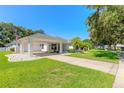 House exterior showcasing a carport and well-maintained landscaping at 4088 Clock Tower Dr, Port Orange, FL 32129