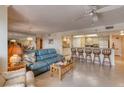 Open concept living room with kitchen and breakfast bar at 1513 Ocean Shore Blvd # 3C, Ormond Beach, FL 32176