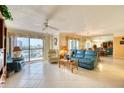 Spacious living room with ocean view and tiled floors at 1513 Ocean Shore Blvd # 3C, Ormond Beach, FL 32176