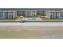 Oceanfront building with beach access and a pool area at 4175 S Atlantic Ave # 1130, New Smyrna Beach, FL 32169