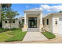 Elegant entryway with a double door and a covered porch at 200 John Anderson Dr, Ormond Beach, FL 32176